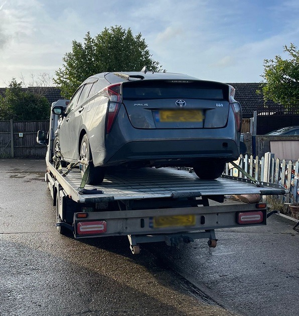 Car on an Instant Recovery flatbed truck during a vehicle recovery job in Dagenham