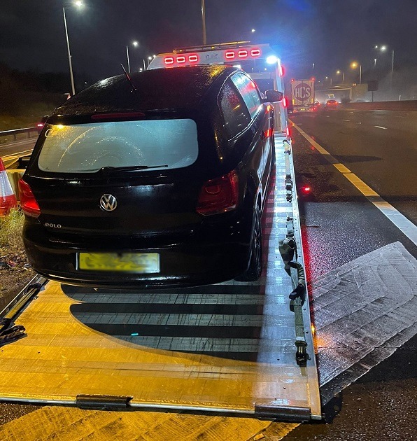 Car on an Instant Recovery flatbed truck during a vehicle recovery job in Romford