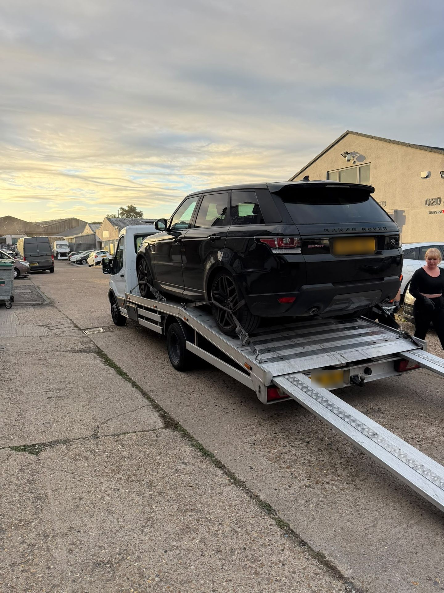Car on an Instant Recovery flatbed truck during a vehicle recovery job in Ilford